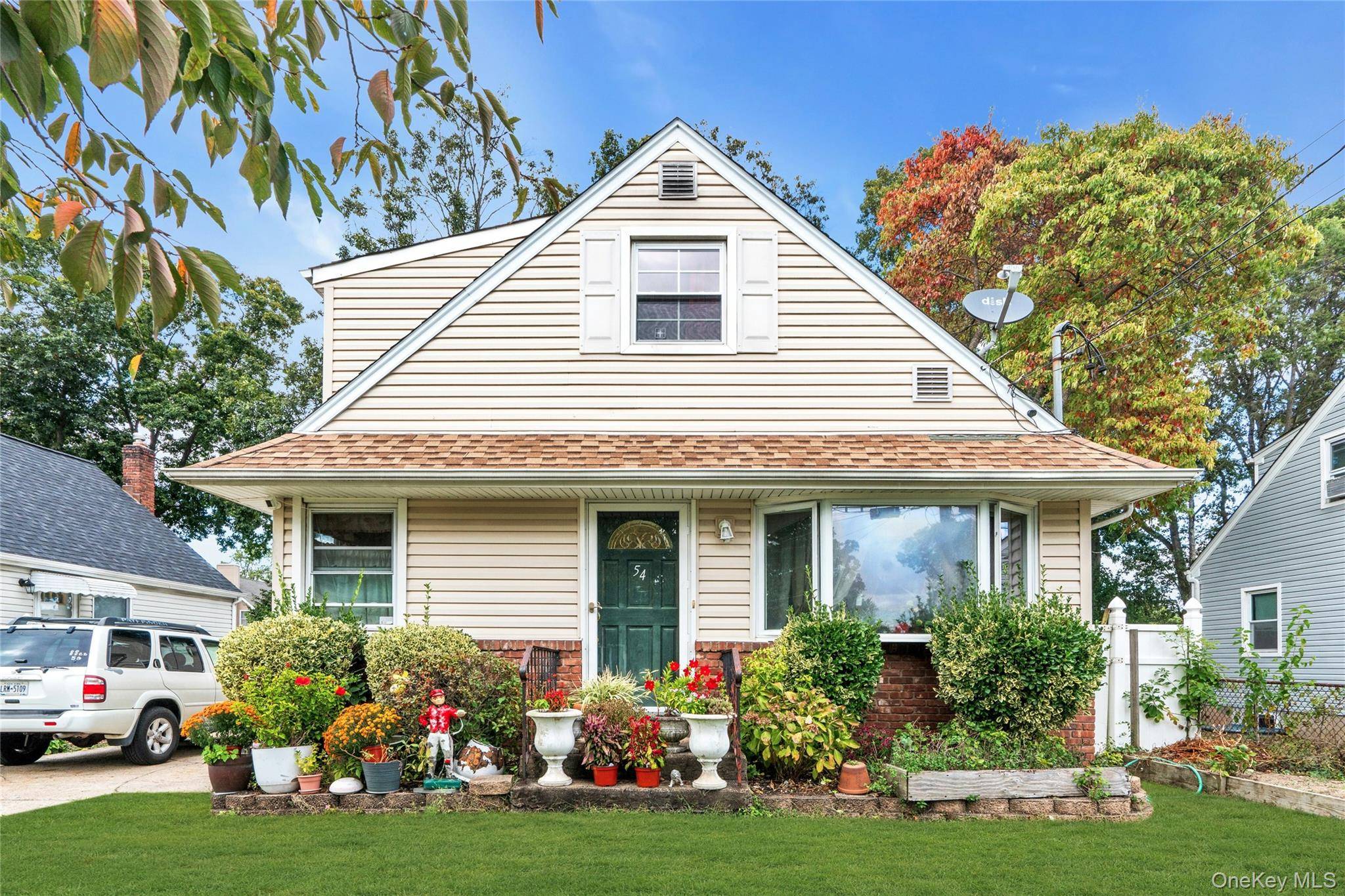 Welcome to 54 E 15th Street, a charming residence nestled in the heart of Huntington Station, NY.