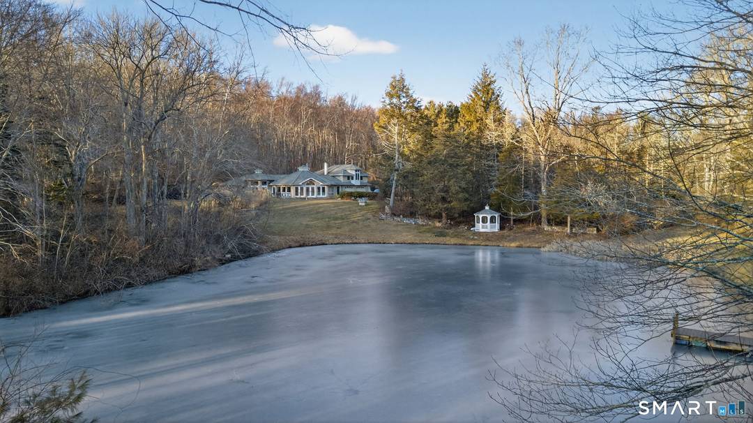 Beautiful Post and Beam design home, Tranquil setting nestled on 25 acres with pond, babbling brook, and hiking trails nature at it best.
