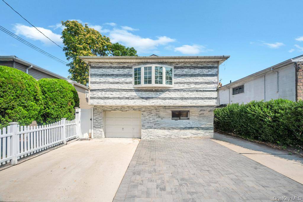 Welcome home to this meticulously updated Hi Ranch in the heart of Hempstead, offering 4 bedrooms and 2 full baths across two spacious floors.