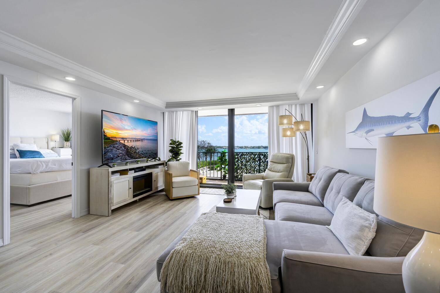 Turnkey waterfront beauty with unobstructed Intracoastal views and private beach !