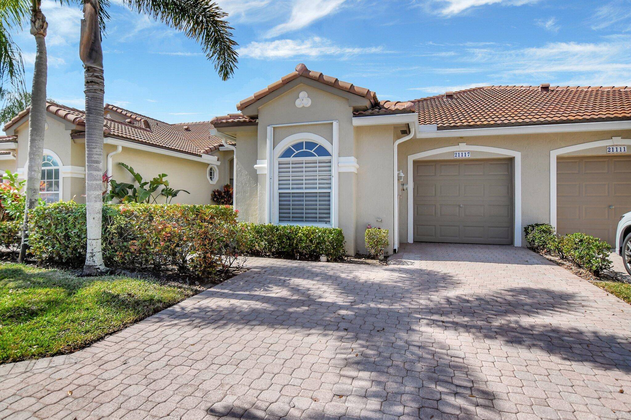 UPDATED SOUGHT AFTER VILLA WITH LAKE PRESERVE VIEWS WITH EXTENED SCREENED IN PATIO.