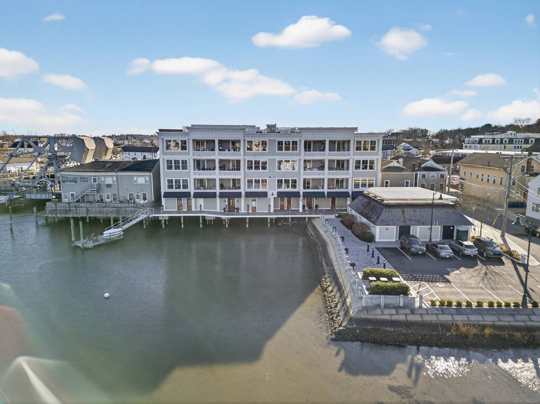 CENTRAL HALL MYSTIC LIFE AT THE WATER'S EDGE There's something special about living where the Mystic River becomes your quiet constant and the village offers its steady beat just beyond ...