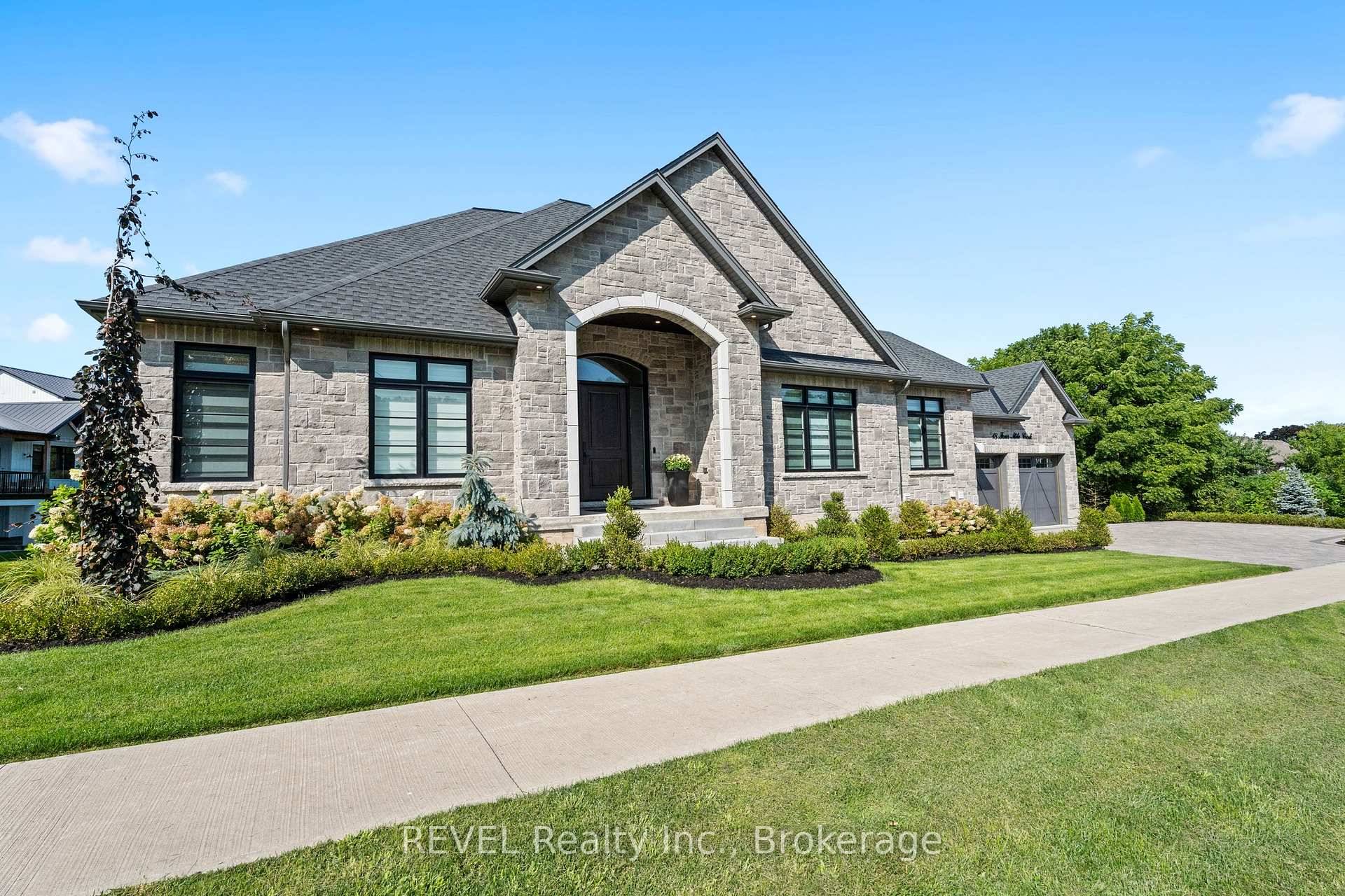 Welcome to this stunning custom built stone bungalow with 2, 750 sqft of finished living space, on a large irregular pie shaped lot with mature trees.