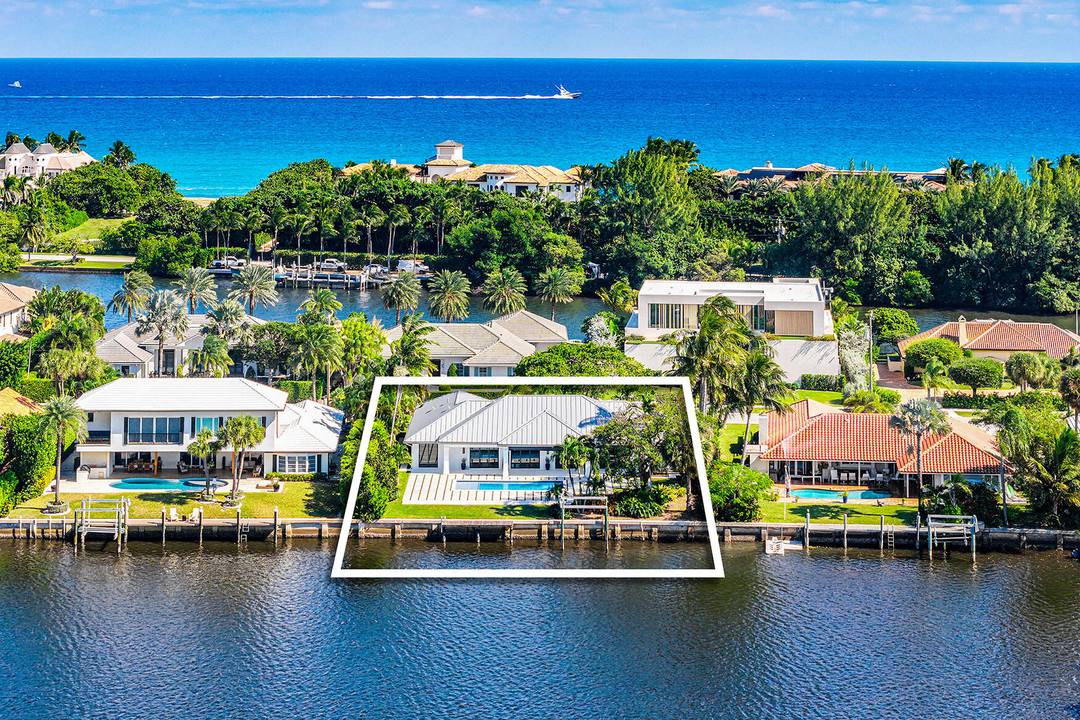 Just completed and rarely available is this exquisitely rebuilt waterfront residence in the coveted, guard gated community of Point Manalapan.