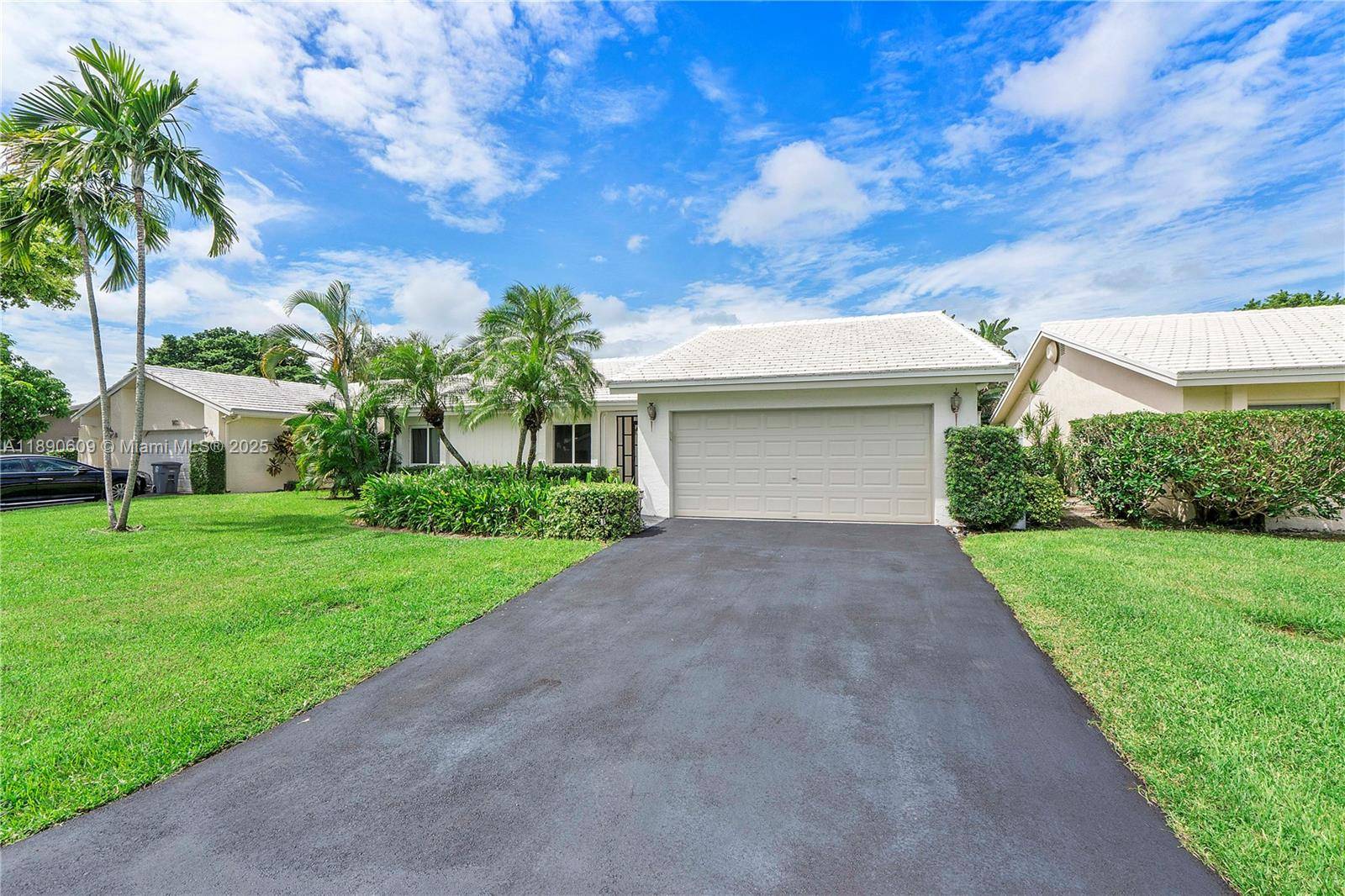 Discover Paradise. A well updated home, perfectly situated in the heart of Boca, adjacent to the prestigious Via Mizner Golf Course.