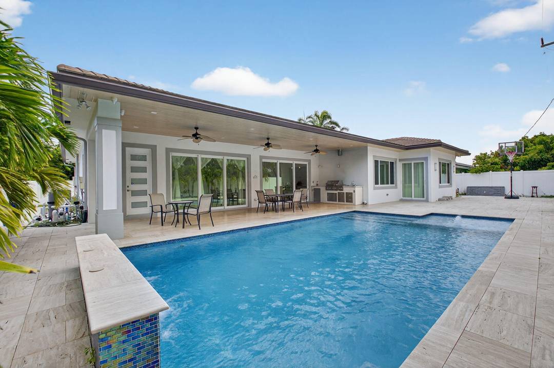 Welcome to your dream coastal living style walking distance to Boca Raton's pristine beaches and exclusive Red Reef Golf Course.