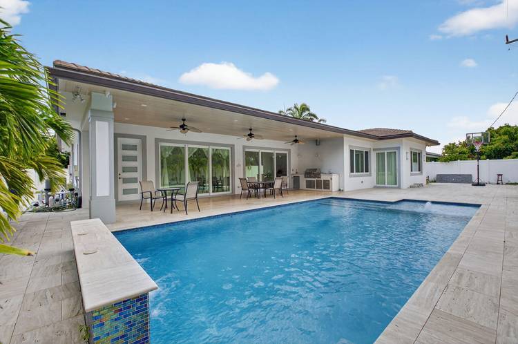Welcome to your dream coastal living style walking distance to Boca Raton's pristine beaches and exclusive Red Reef Golf Course.