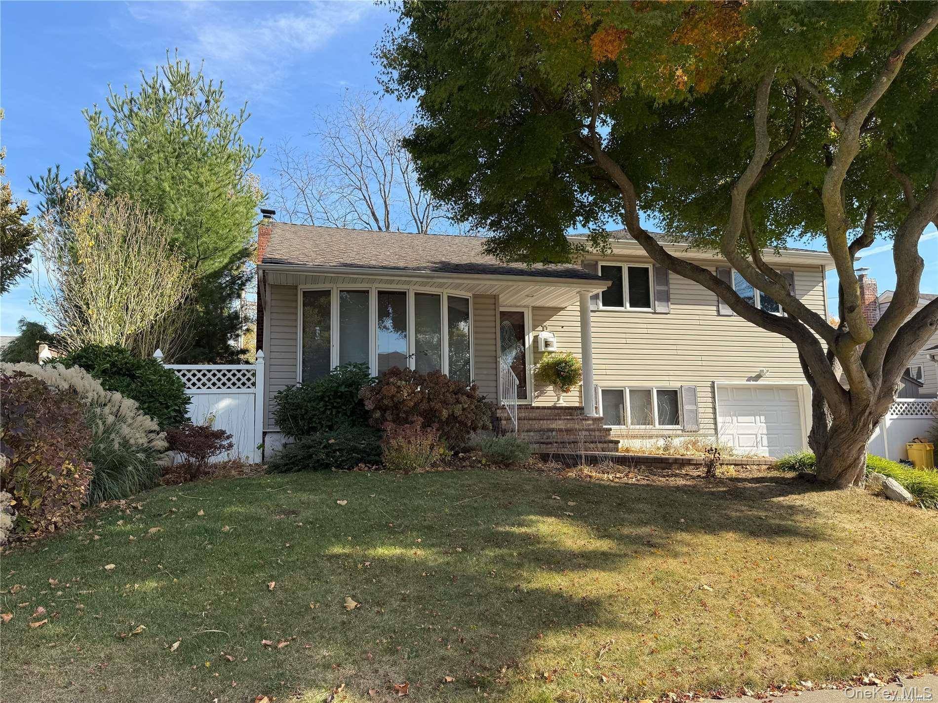 Well Maintained Split Level, Vaulted Ceilings, Hardwood Floors, Large Deck, Gas Heating And Cooling, !