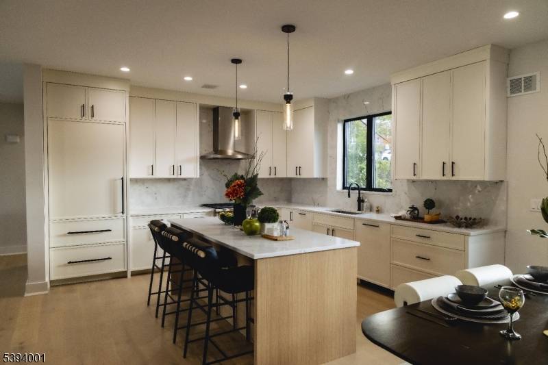 New Construction Townhomes in Leonia Modern 3 bedroom plus den residence featuring white oak flooring, Wolf appliances, and a bright open concept layout with 2 full and 2 half baths.