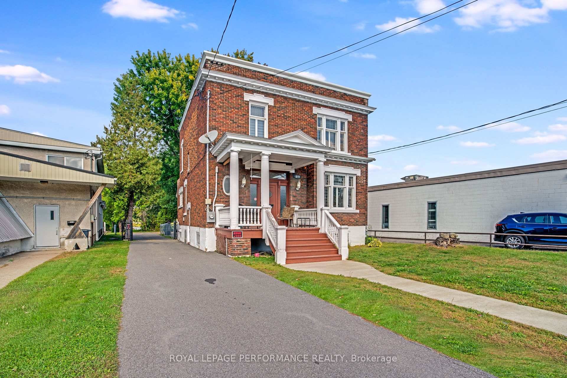 Tucked into the vibrant heart of Hawkesbury, this stately 1933 brick residence marries timeless architecture with a rare waterfront bonus.