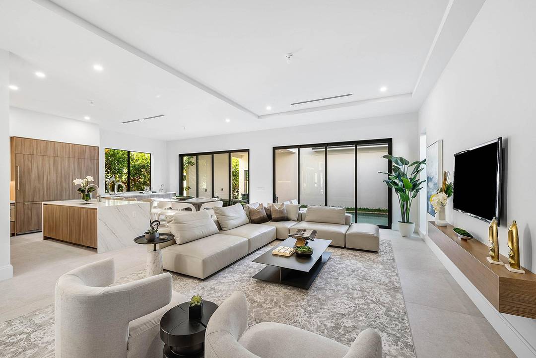 Exquisite new contemporary estate by Marc Julien in East Delray Beach, offering 5 bedrooms, an office, and a three car garage.