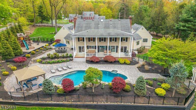 A rare offering of architectural distinction, this custom residence modeled after George Washington's Mount Vernon was designed and built by award winning builder Robert Shaw as his personal family home.