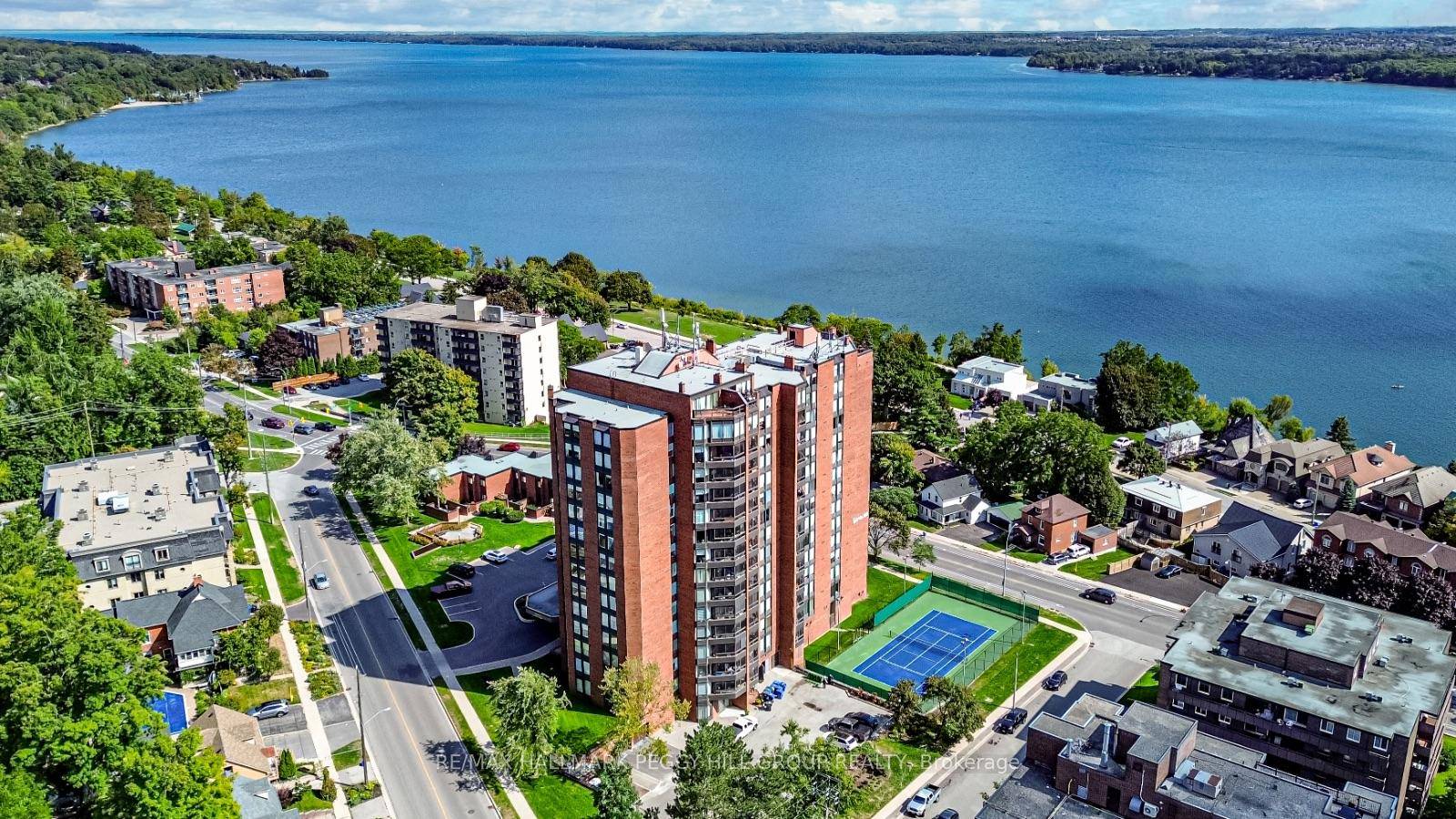 HIGHLY REGARDED BAY CLUB CONDO STEPS FROM KEMPENFELT BAY WITH UNBEATABLE AMENITIES, A STRONG COMMUNITY, amp ; STUNNING SUNROOM WITH WATER VIEWS !