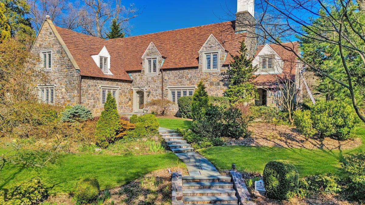 Welcome to 15 Rutland Road, a masterfully restored Tudor nestled in the prestigious Cotswold section of Edgemont.