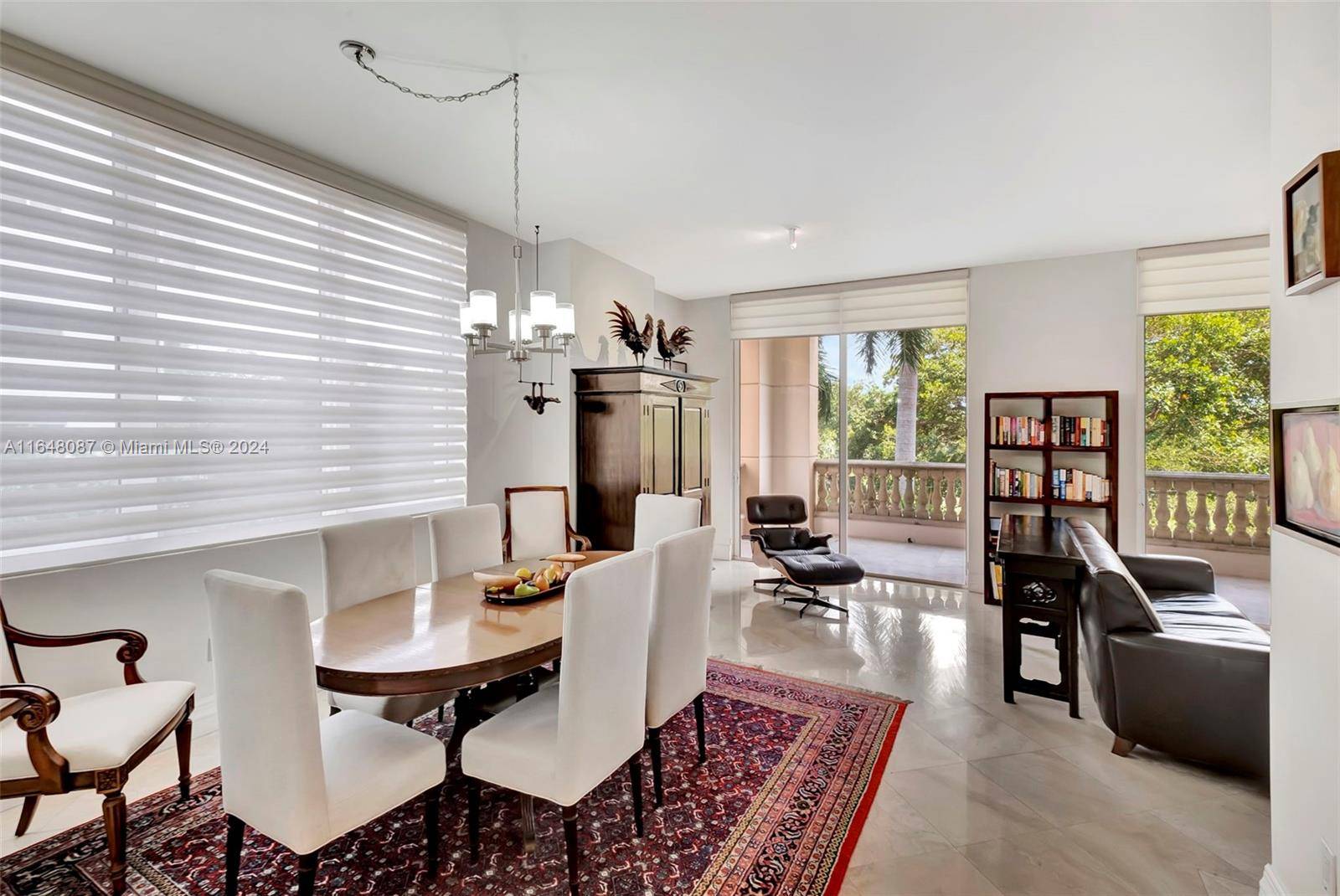 Embrace the elegance of Coral Gables in this stunning residence at Gables on the Green, perfectly positioned across from the serene Granada Golf Course.