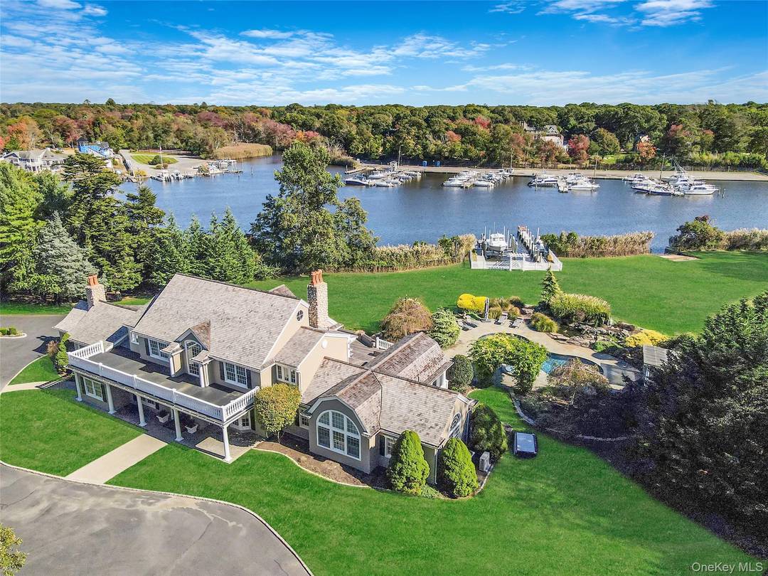 This Stunning Waterfront Estate Offers An Unparalleled Blend Of Luxury And Nature On Nearly 2 Acres Along Champlin Creek.