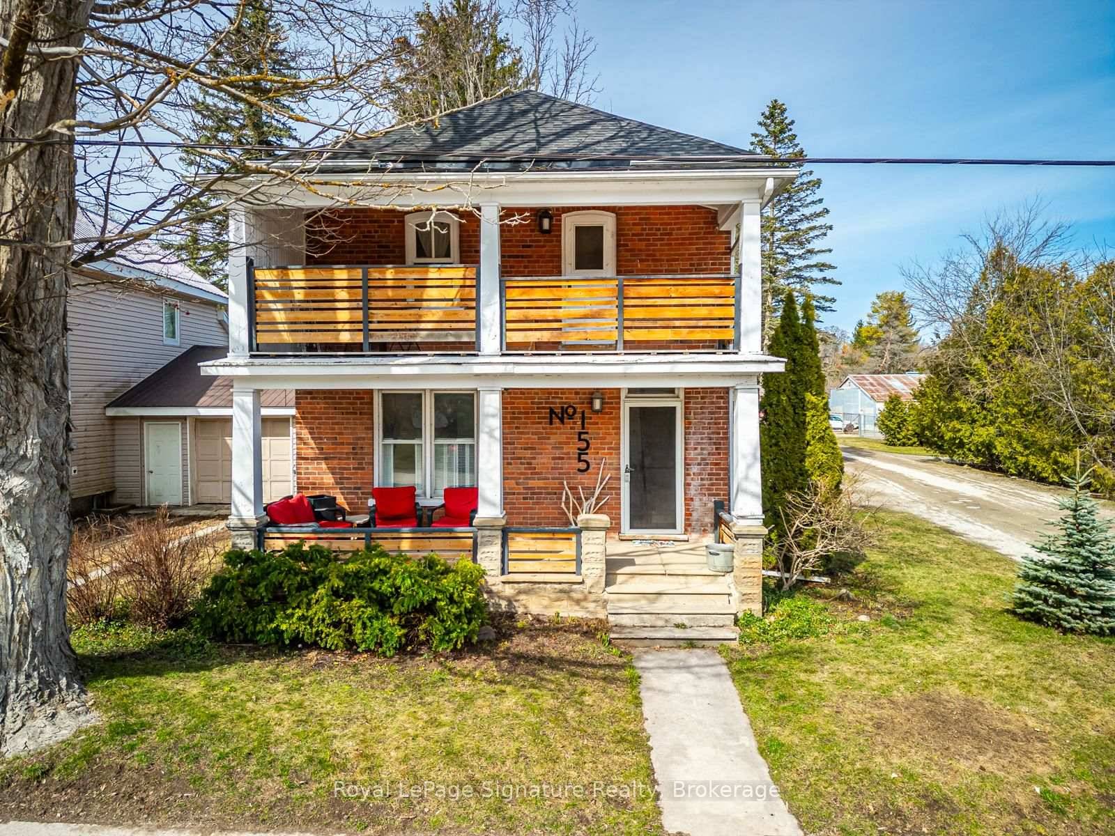 In the heart of Clarksburg, this classic red brick home seamlessly blends historical charm with modern comforts.