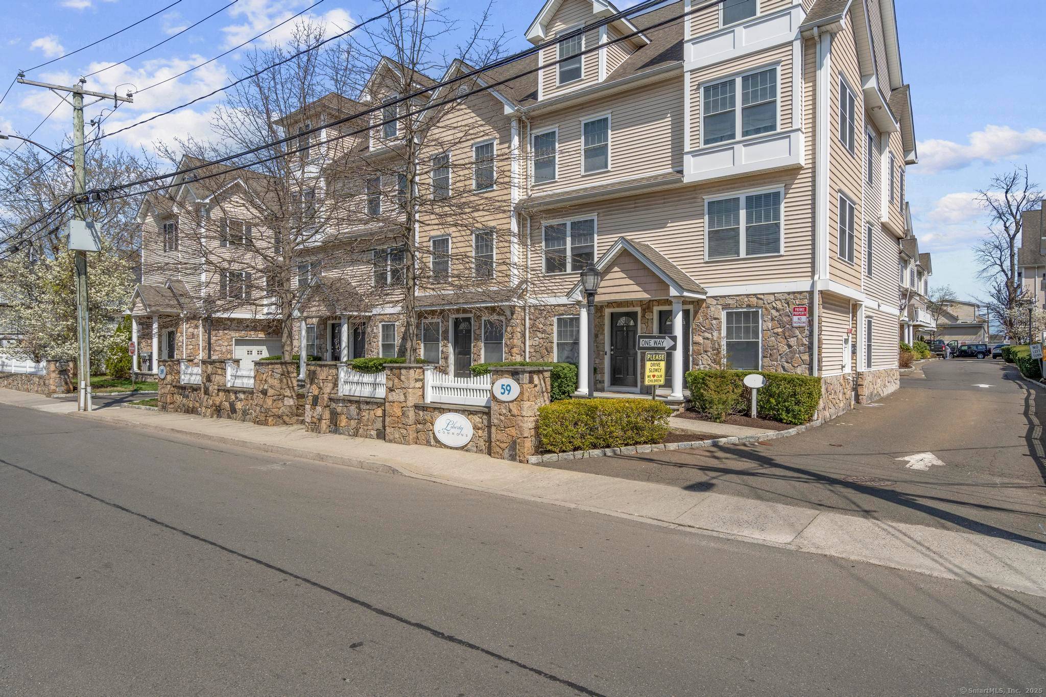 This beautiful move in ready townhome features custom paneling, crown moldings, and hardwood floors throughout.