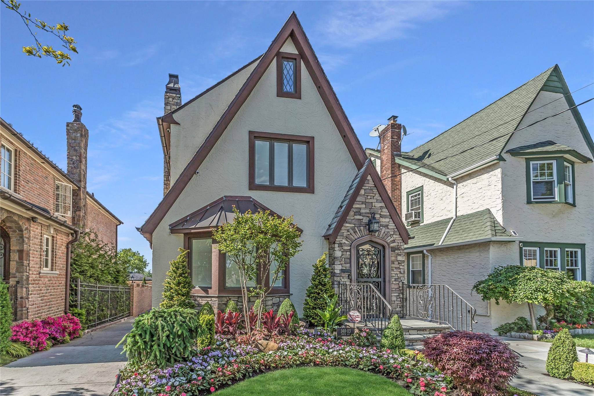 Welcome to 148 03 9th Avenue a fully renovated Tudor blending classic charm with modern luxury on a 33.