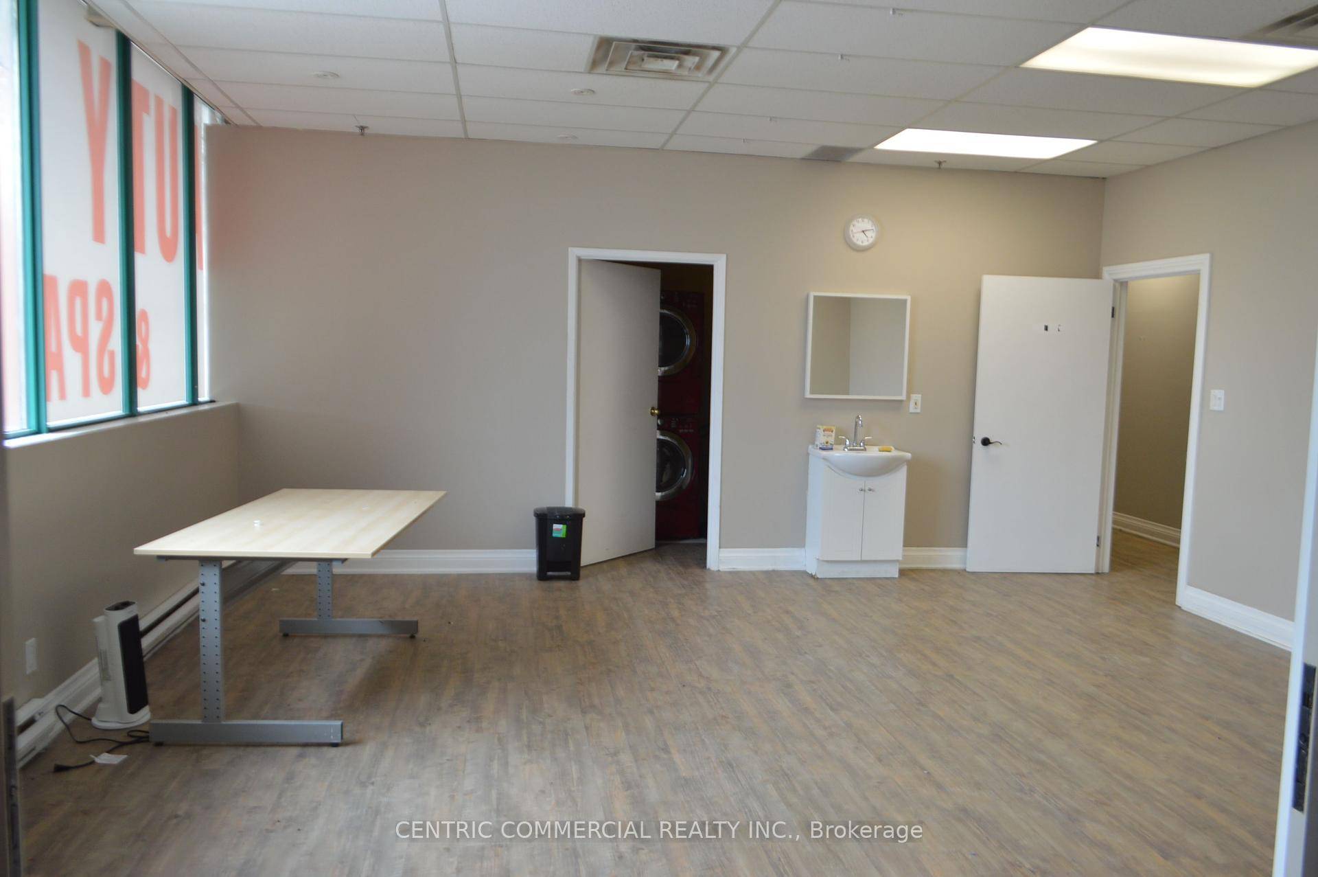 Exceptionally bright 2nd floor unit in vibrant retail commercial plaza with wide window signage exposure to Dundas.