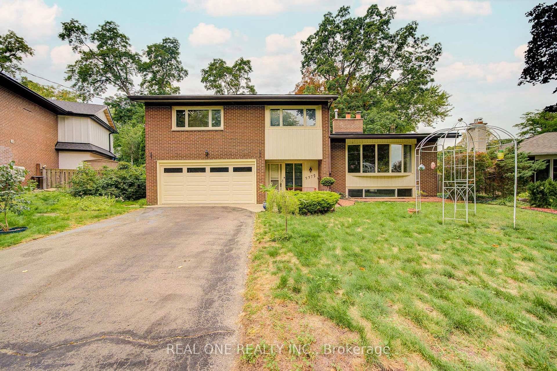 Outstanding quality built home on a large pie shaped treed lot with perennial gardens and flagstone patios.
