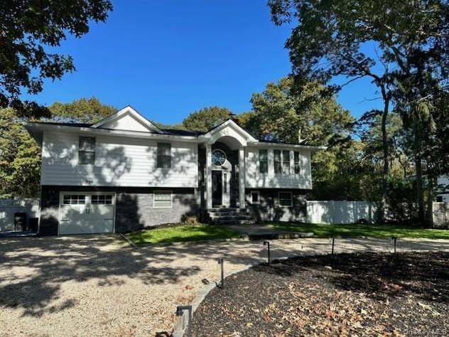 Newly Renovated Hi Ranch with Open Concept Kitchen that includes Center Island with Quartz Countertops that can accomodate seating for 6, Wine Fridge amp ; Microwave, Dining Area with Sliders ...