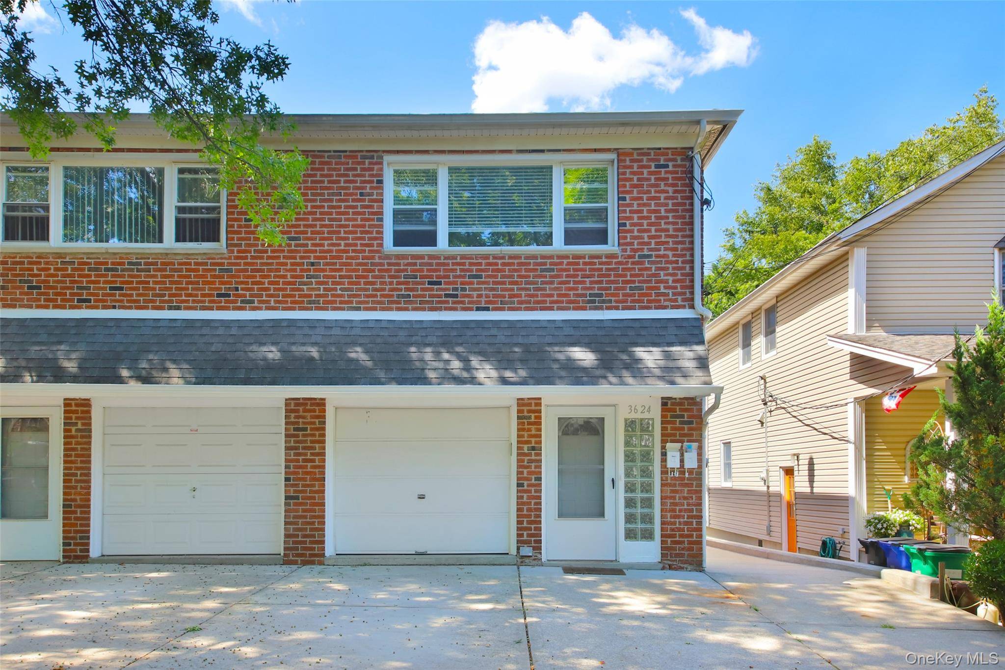 Welcome to this charming two family semi detached home located on a quiet, tree lined block in Bayside.