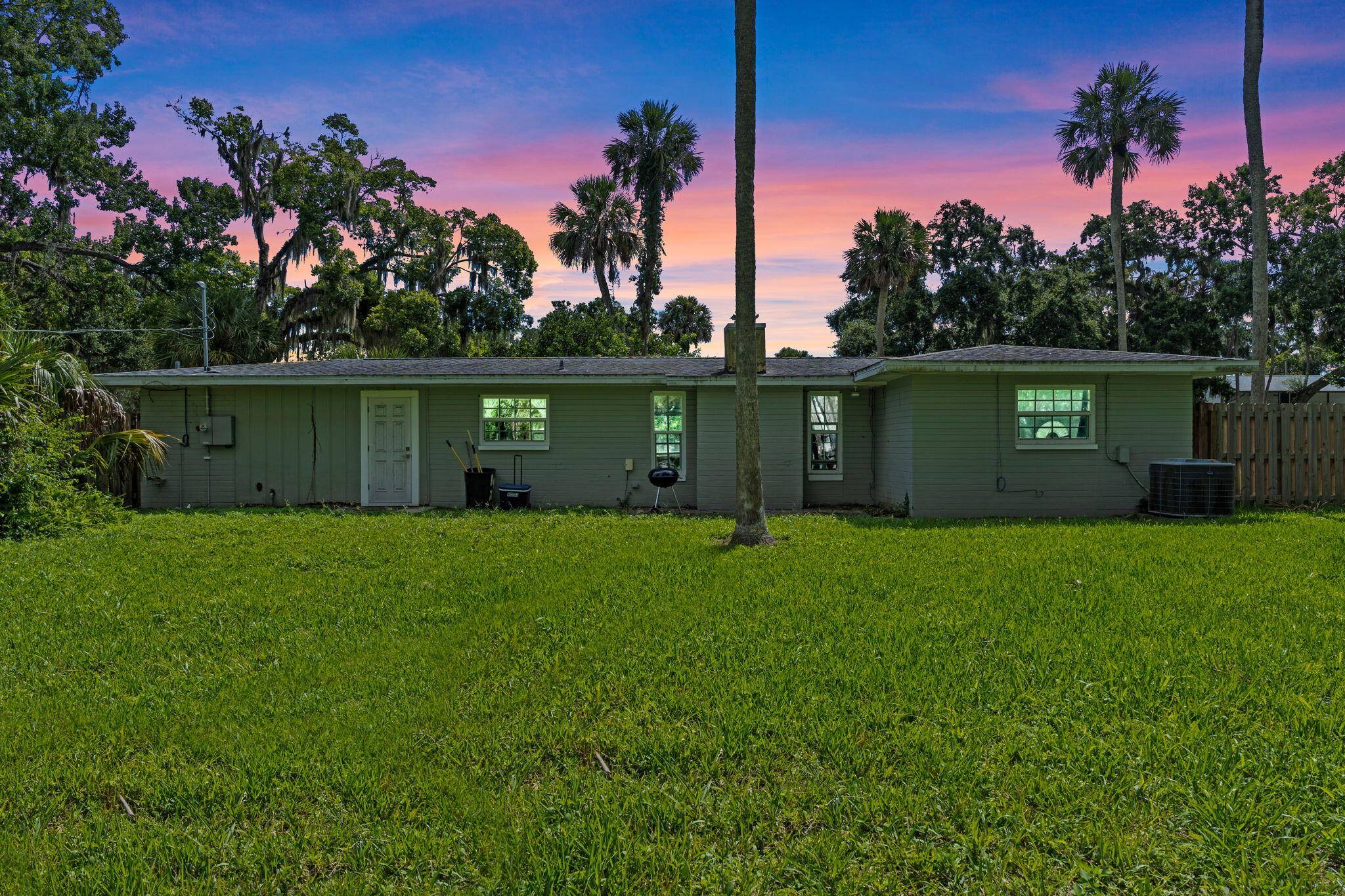 Double Lot Tropical Retreat with Historic Charm Priced to Sell !