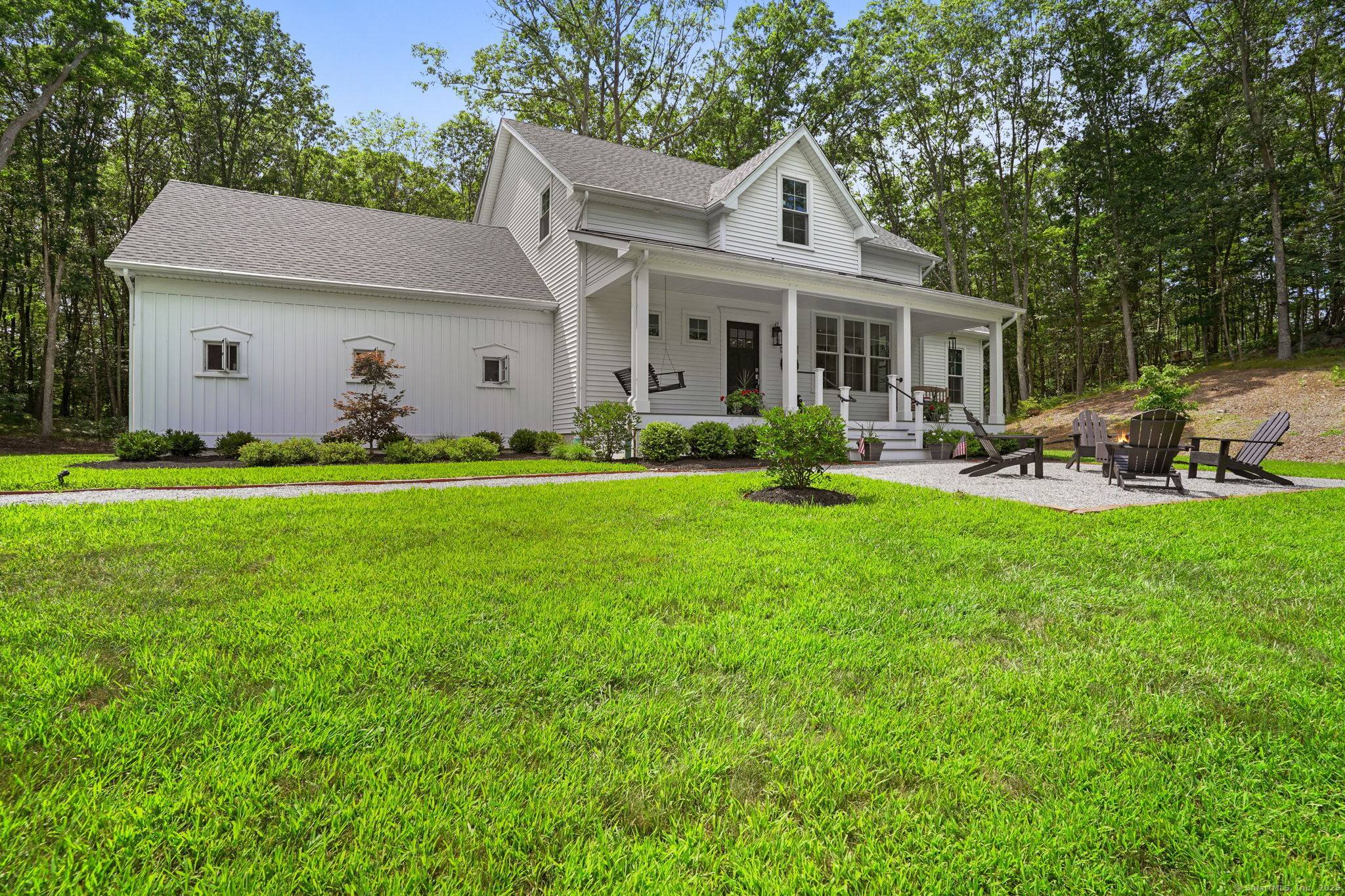 Experience serenity, security and seclusion in this newer classic Farmhouse.