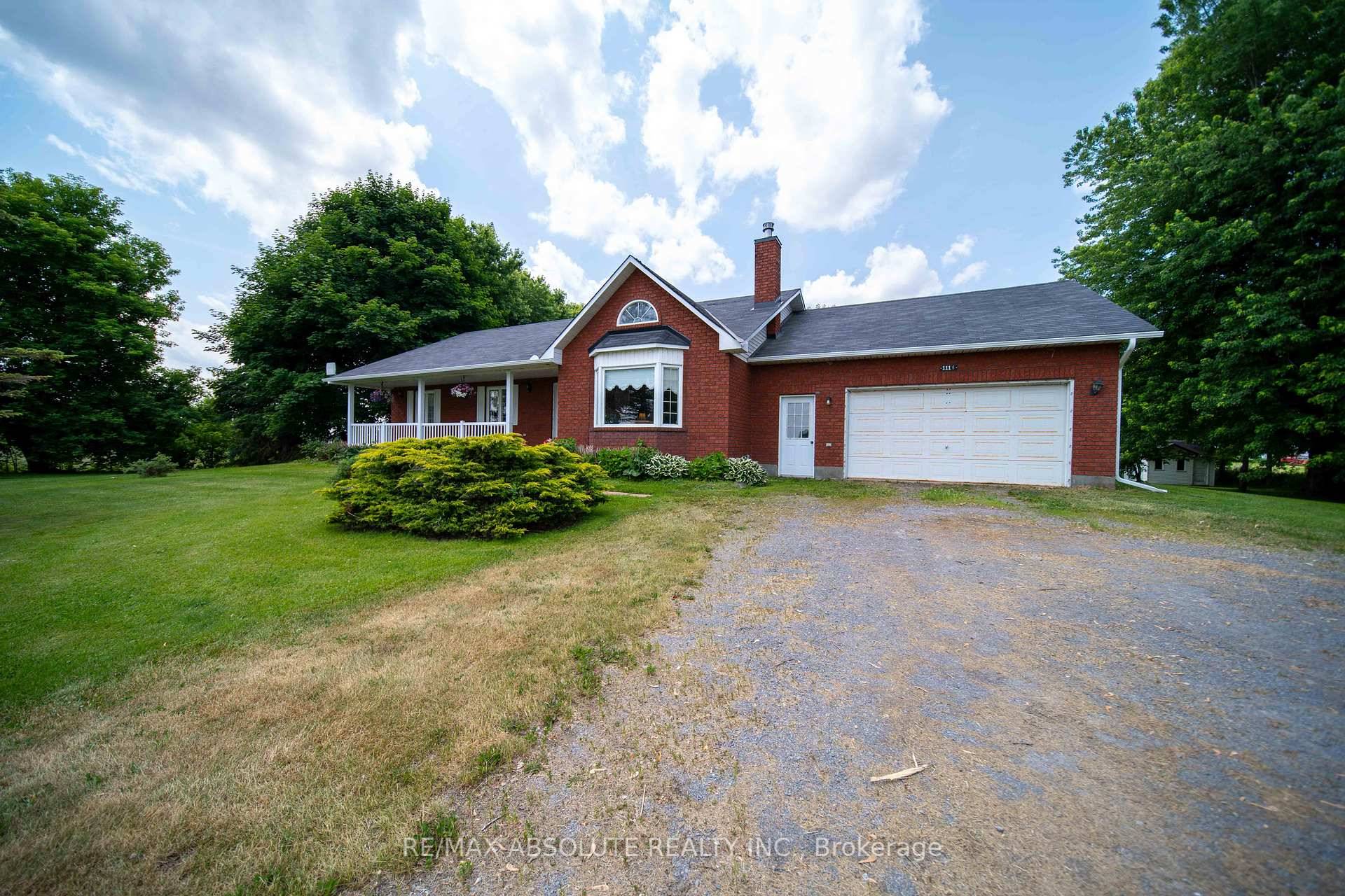 This half brick, half siding bungalow offers 3 bedrooms and 1.