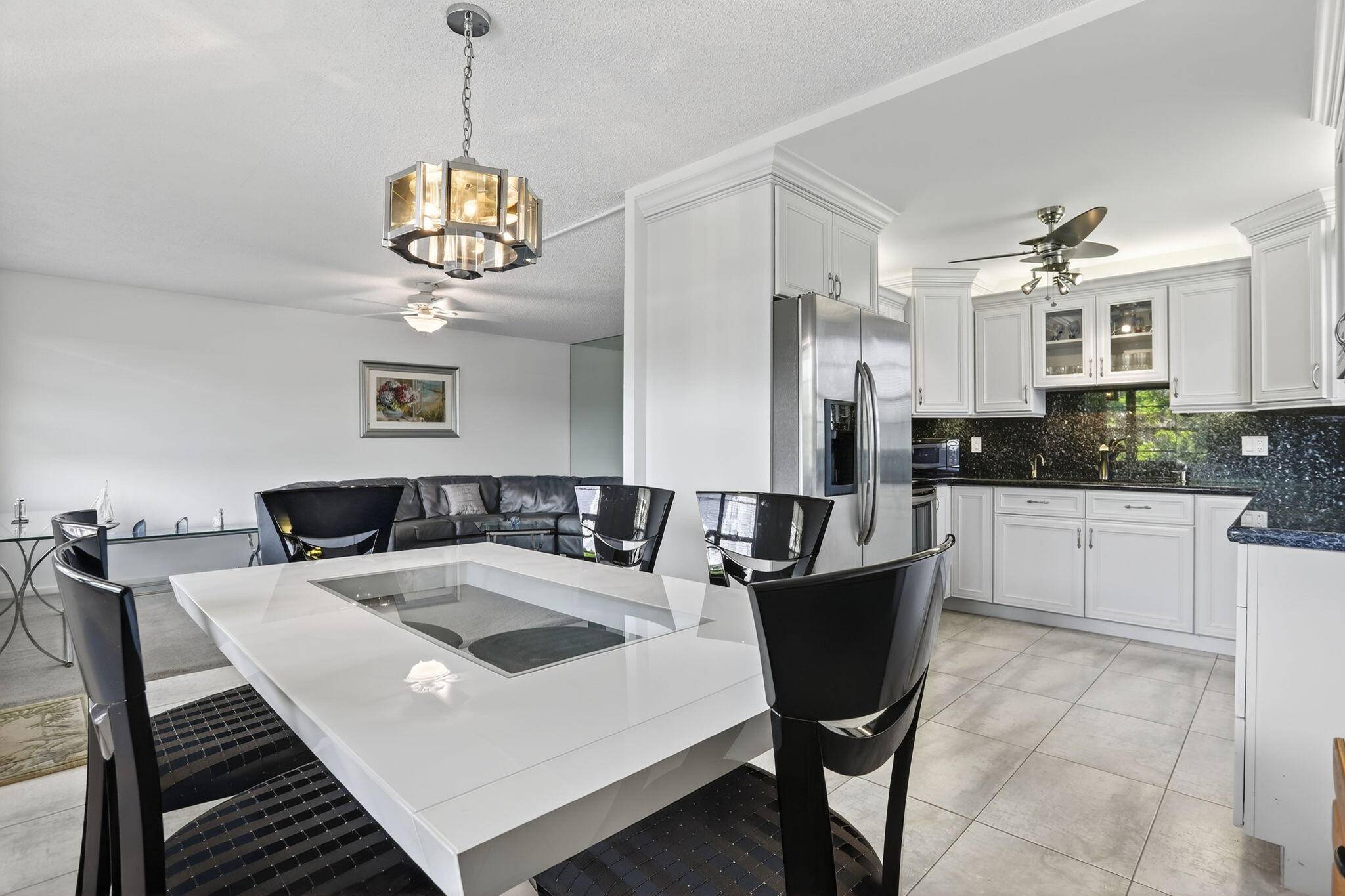 Corner gem, 2 bedrooms, 2 full bathrooms with renovated kitchen and stainless steel appliances is bright move in ready.