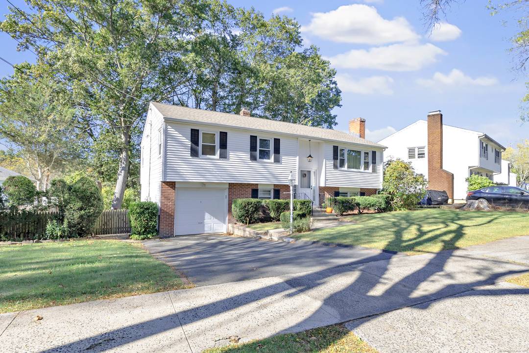 Beautiful home nestled on a quiet tree lined street with sidewalks for taking strolls.