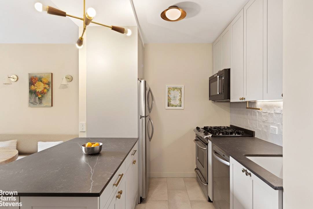 Two units combined creating a large two bedroom, convertible three bedroom home with two full baths and a laundry room with full size machines.