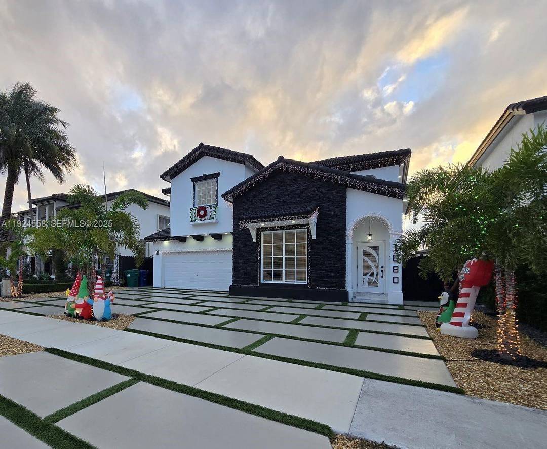 Beautifully renovated 4 bed, 3 bath modern home featuring porcelain floors, high ceilings, a spacious open concept kitchen, and designer finishes throughout.