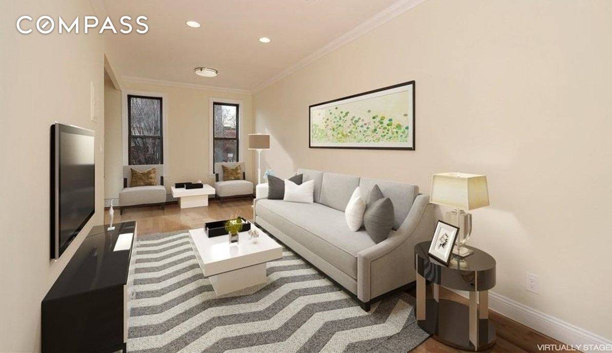 This amazing 3 family gut renovated townhouse with a massive backyard space.