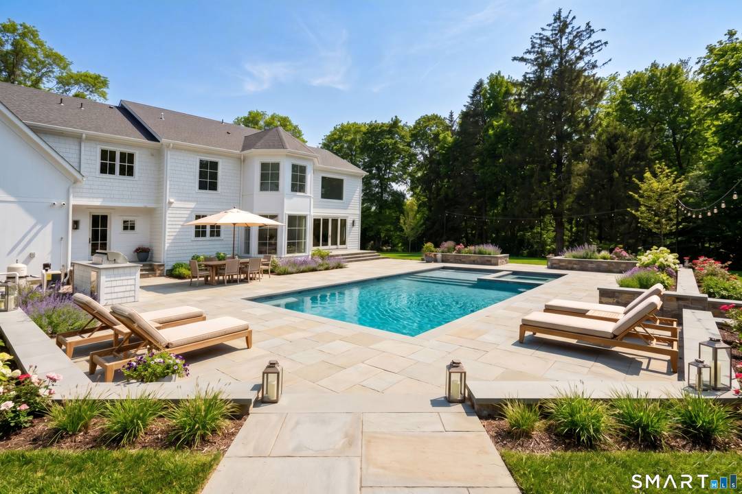 NEW... Stunning transitional 5 bedroom estate blending classic curb appeal with a clean, modern interior beautifully sited on 2.