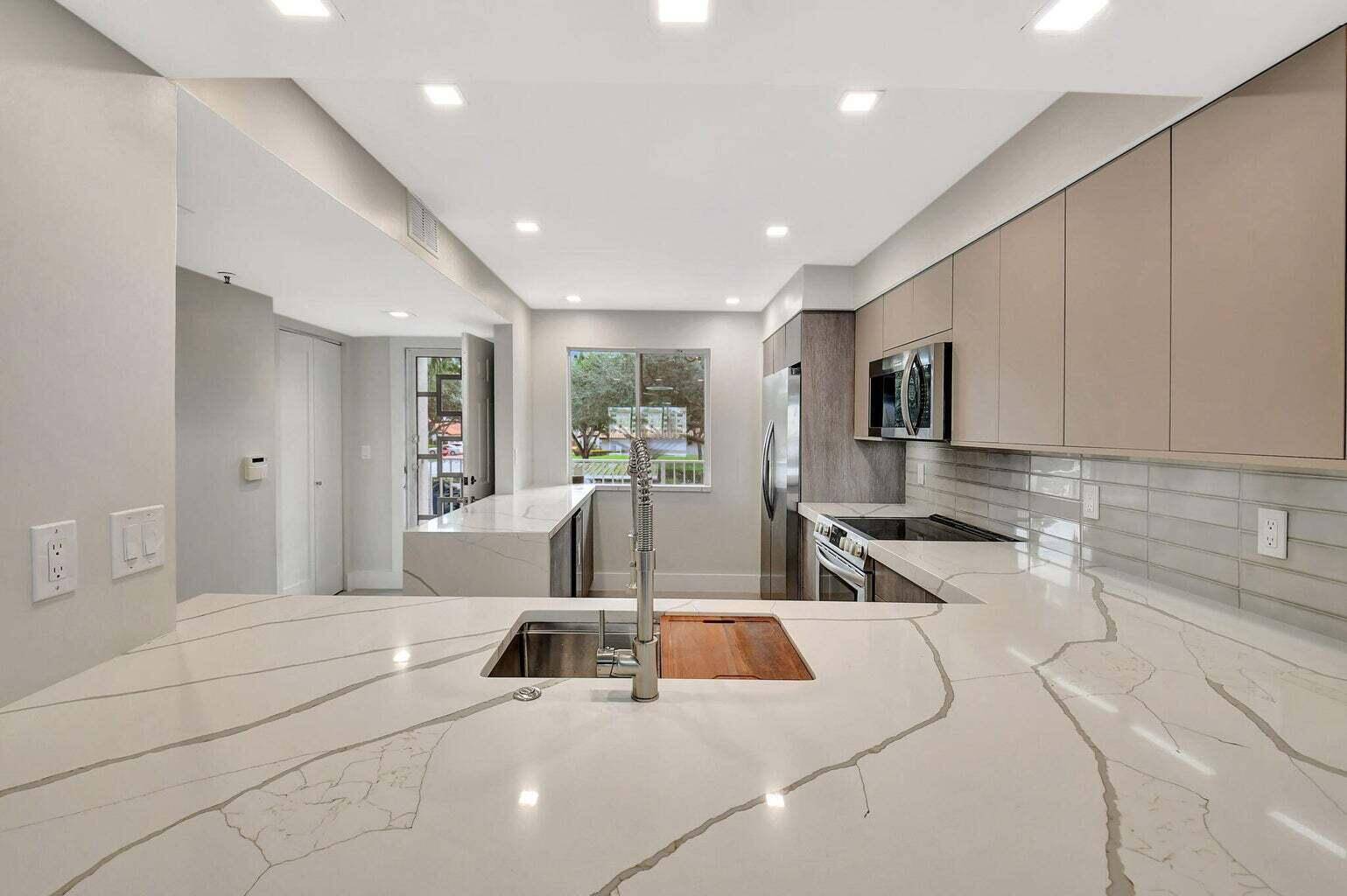 MOTIVATED SELLER ! ! STEP INTO CHIC LUXURY WITH A ONE OF A KIND, CONTRACTOR DESIGNED CONDO COMPLETELY REIMAGINED AND BUILT TO BE THE BEST IN HUNTINGTON POINTE.