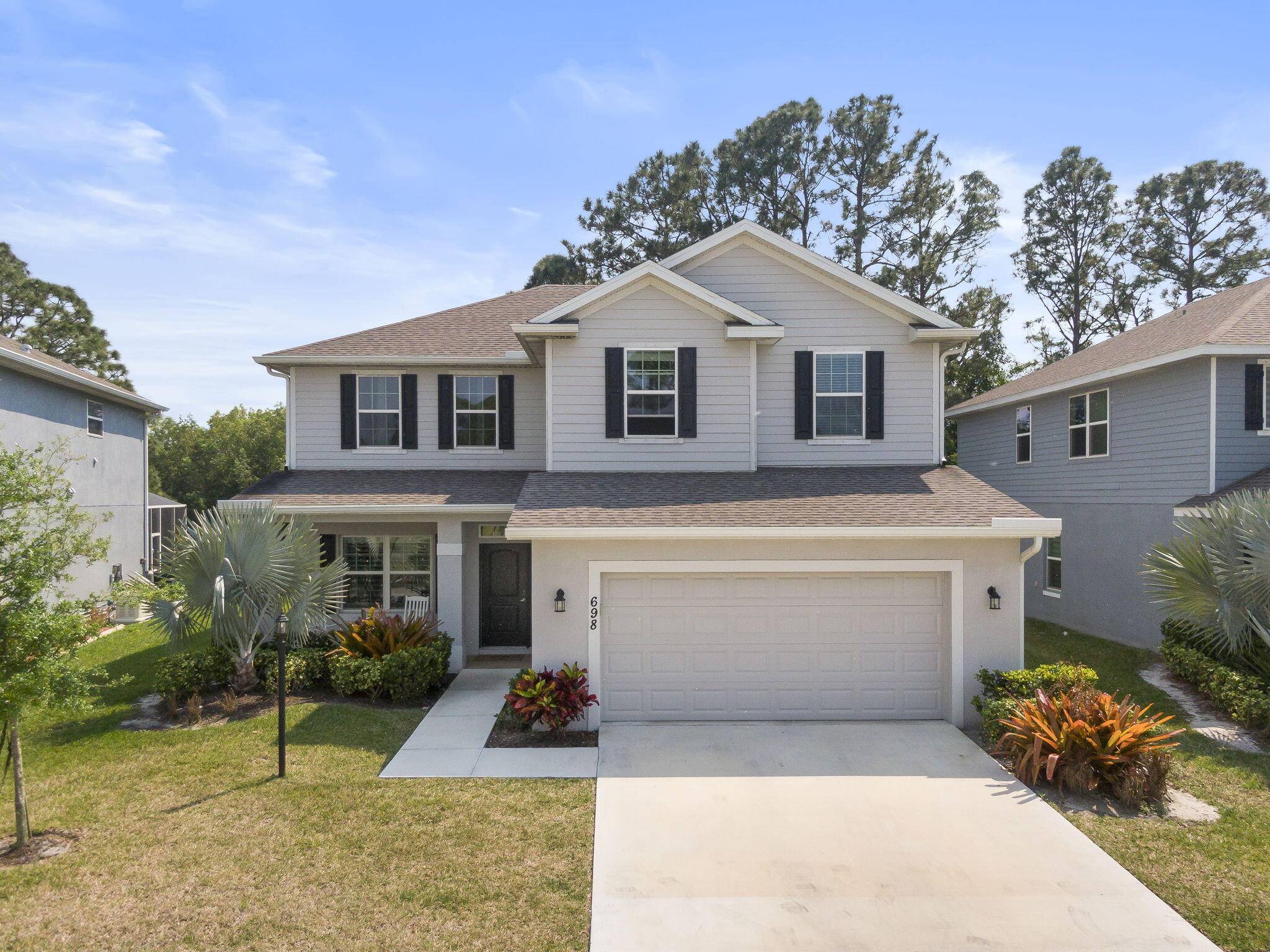 Stunning 5 bedroom, 3. 5 bathroom home built in 2022, featuring the main bedroom conveniently located on the first floor, complete with a beautiful en suite that includes a separate ...