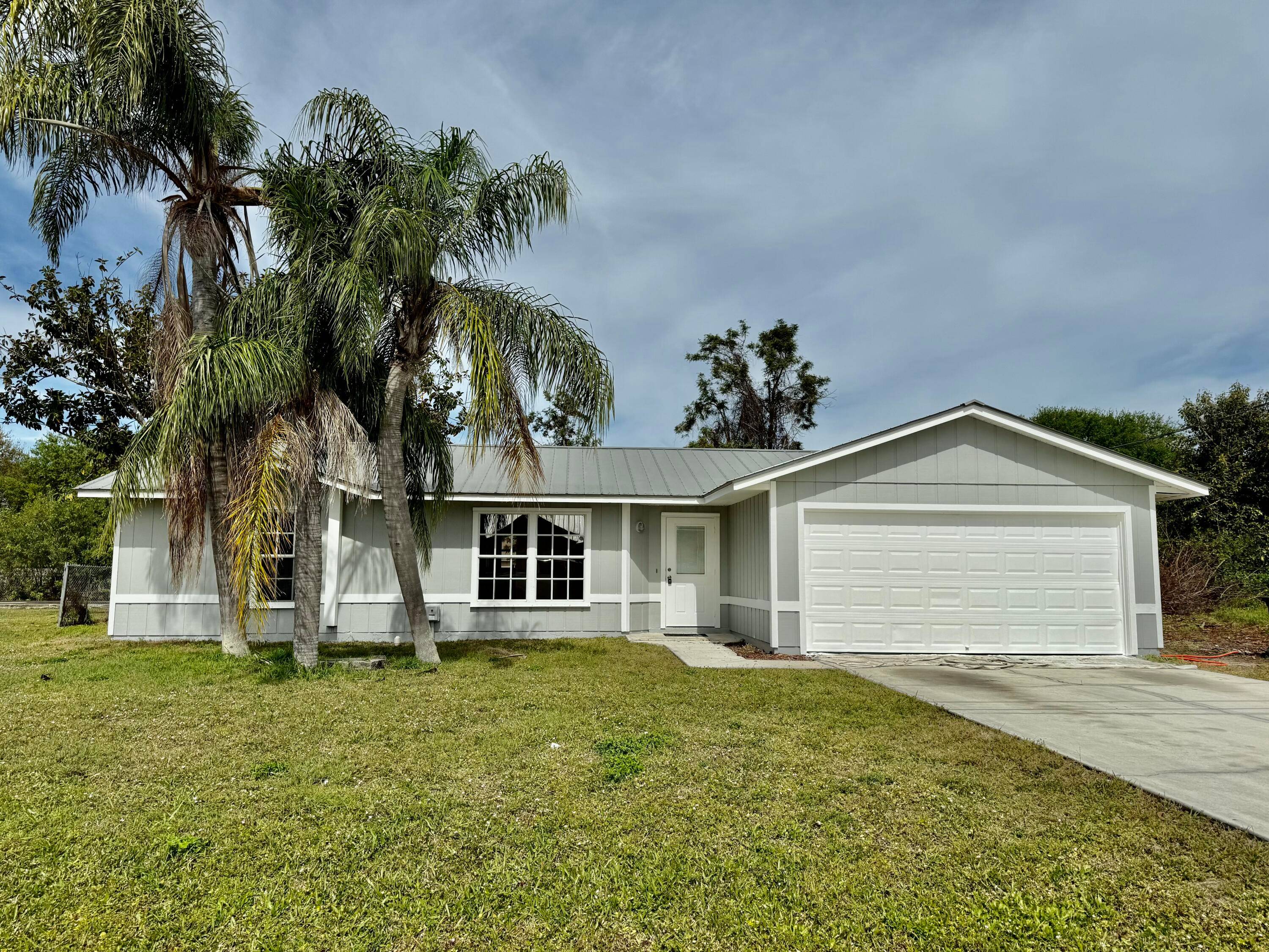 Welcome to this 3 bedroom 2 bath home that is perfectly situated on a Quiet street east of US1, mins to downtown Jensen Beach, Rivers, Beachs and so much more.