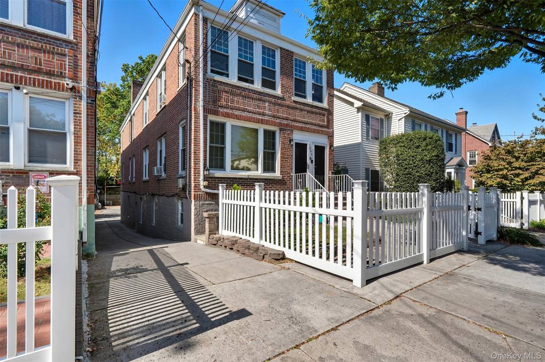 Nestled in the highly sought after Country Club neighborhood, this stunning all brick triplex showcases a perfect blend of timeless craftsmanship, generous living space, and exceptional opportunity.