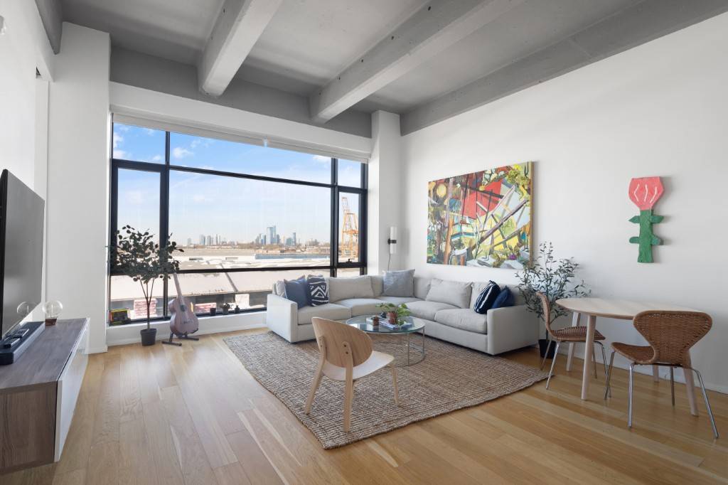 Come explore this stunningly beautiful loft with gated parking space and open harbor views from the Statue of Liberty to lower Manhattan.