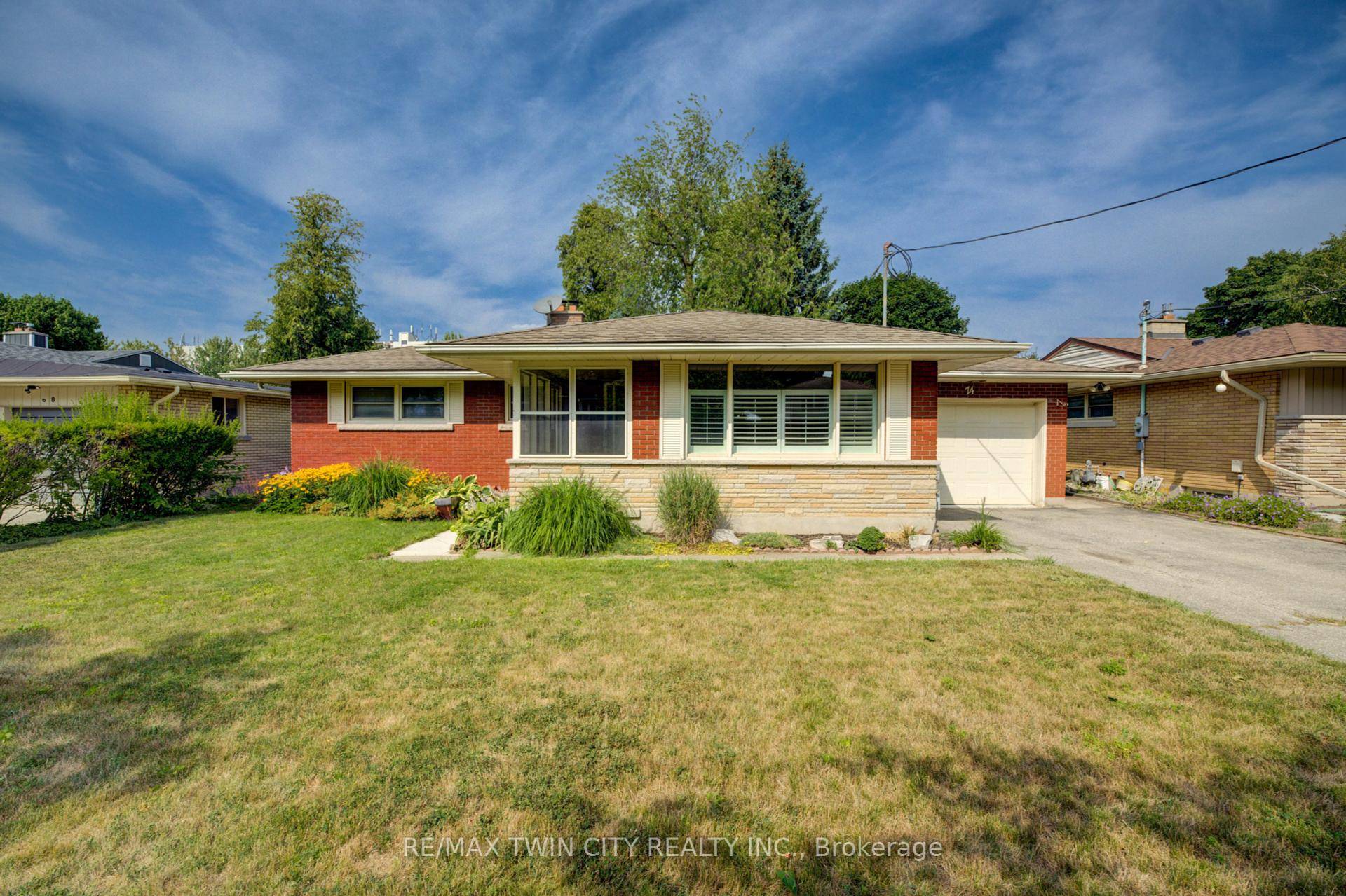BRICK BUNGALOW ON A QUIET STREET BACKING ONTO BEAUTIFUL LAKESIDE PARK WITH A LAKE AND TRAILS !
