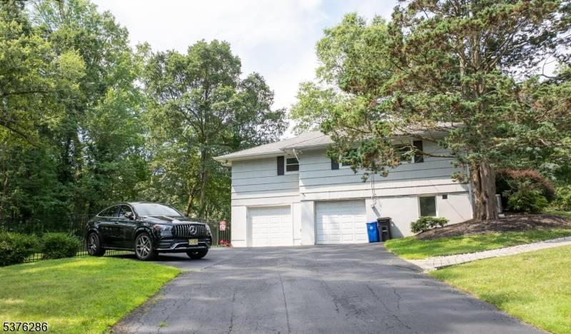 Set on a well landscaped, expansive corner lot in the highly sought after Wood Estates section of Livingston, this home offers the perfect blend of comfort, space, and location.