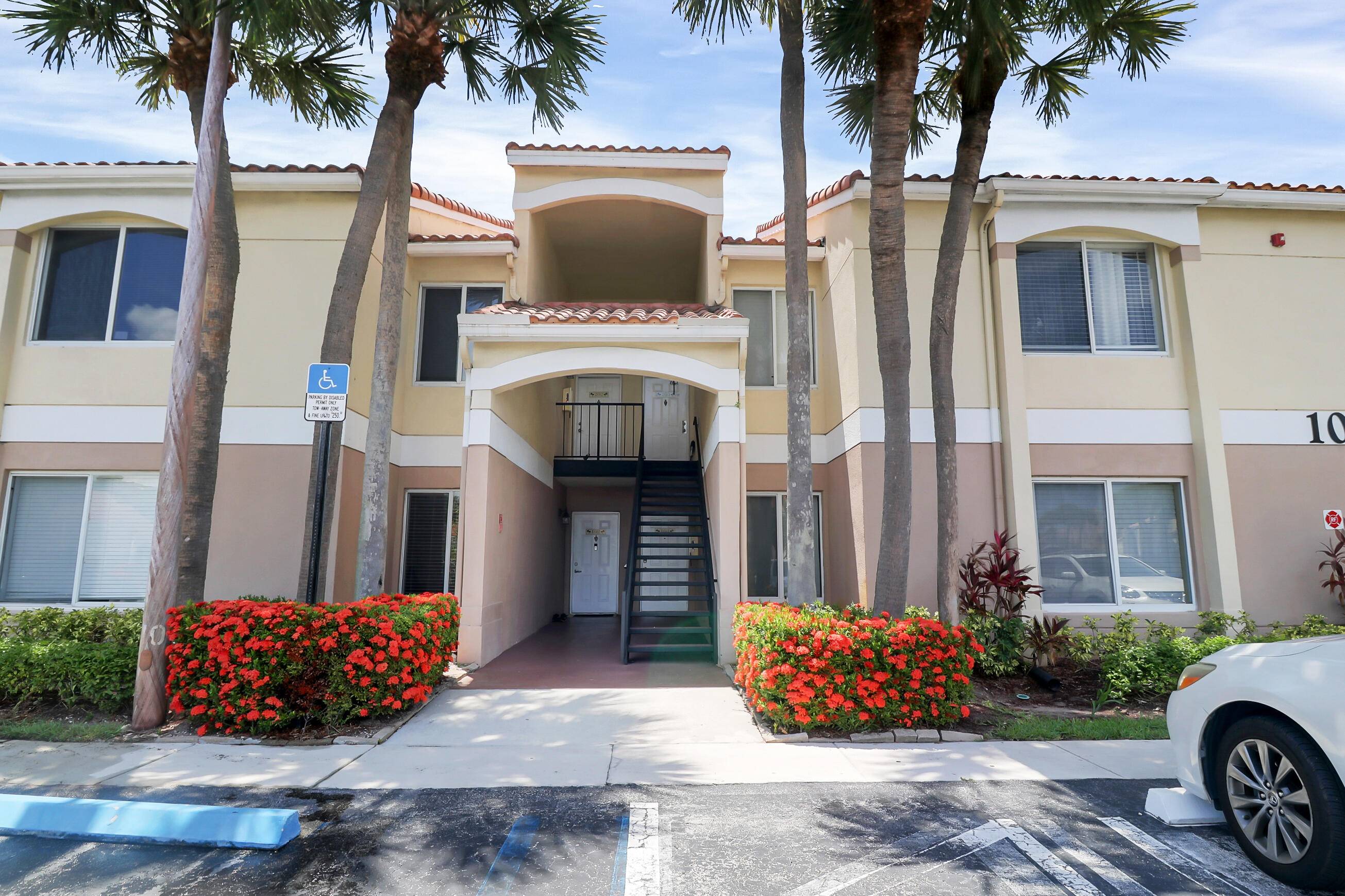 The value is apparent in this light and bright condo with vaulted ceilings and an oversized covered screened patio backing up to a private copse of trees foliage !