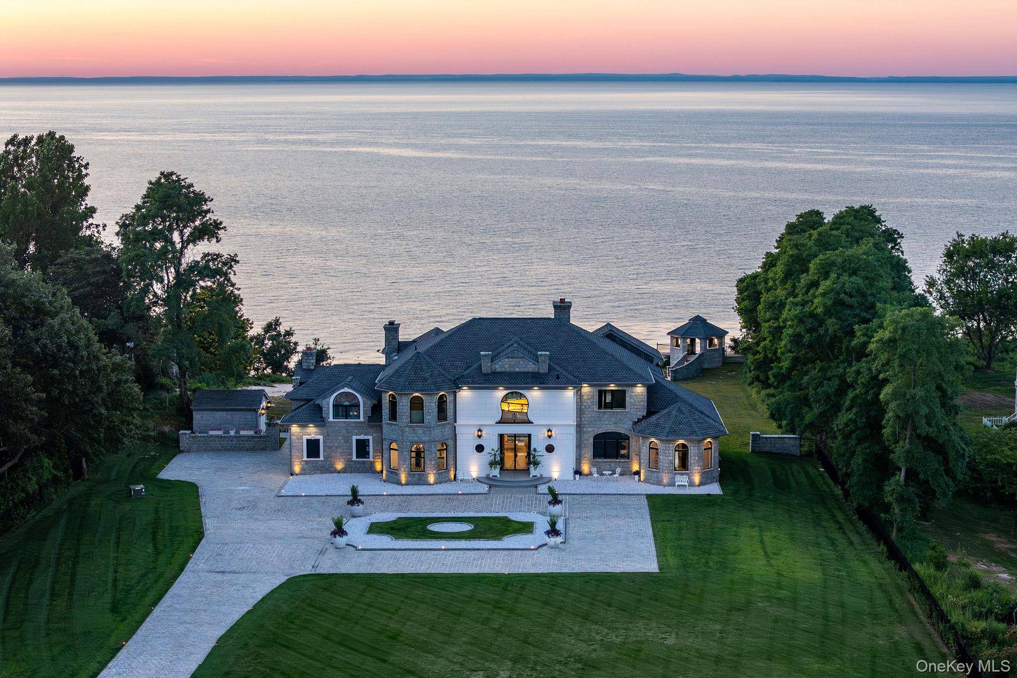 Welcome to Lion's Gate on the Sound, a majestic and impeccably upgraded waterfront estate set on over 3 private, gated acres along the coveted shoreline of the Long Island Sound ...