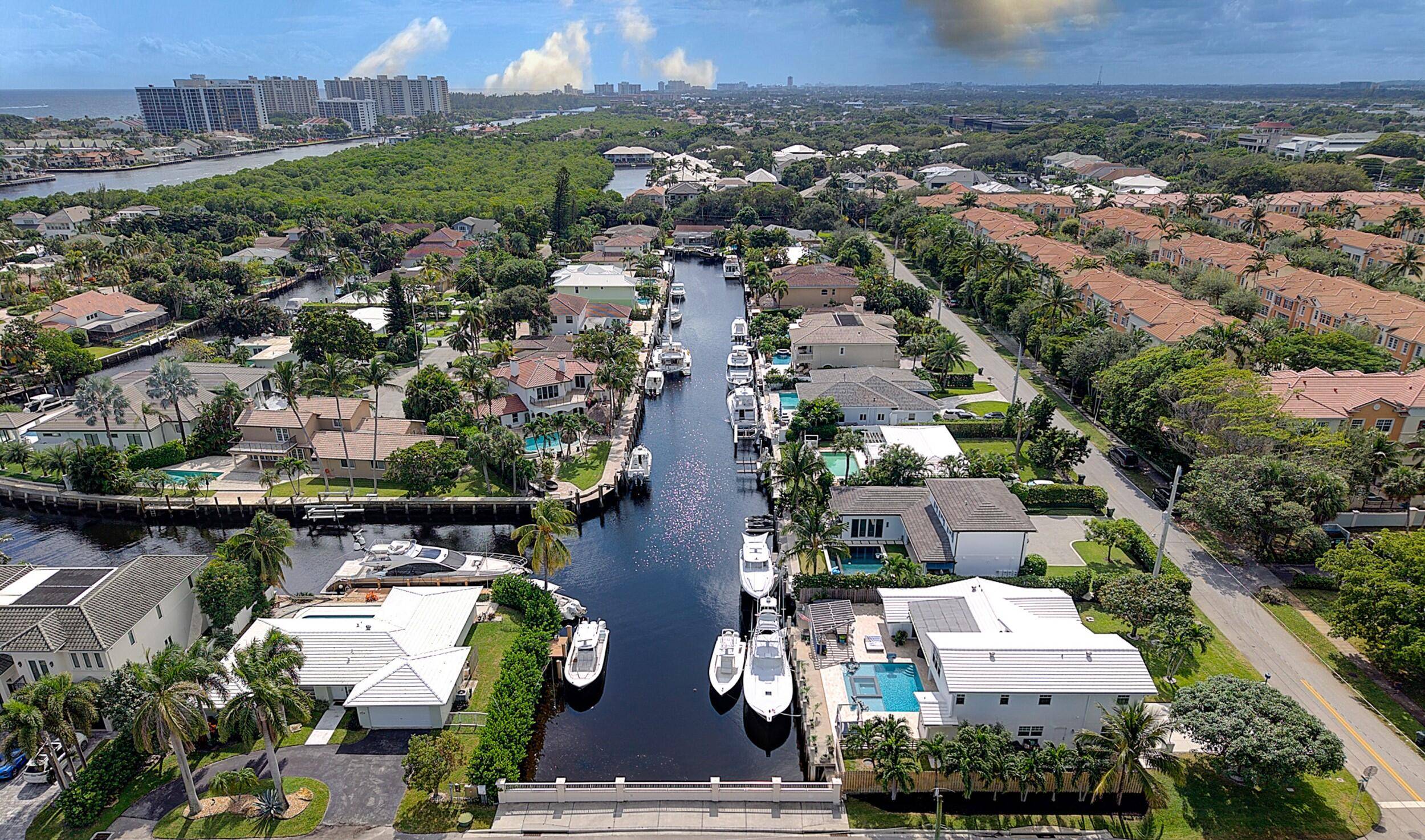 Experience luxury waterfront living in this Deepwater Dream Home, featuring a resort style pool and spa, tiki bar, and a fully equipped summer kitchen perfect for entertaining.