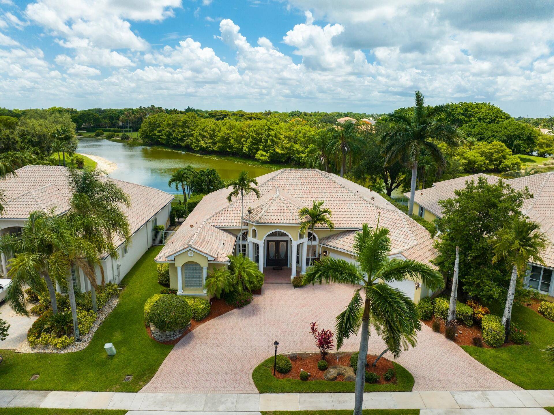 Luxury meets comfort in this 4, 599 sqft lakefront Mikasa model in Crystal Pointe at Boca Falls.