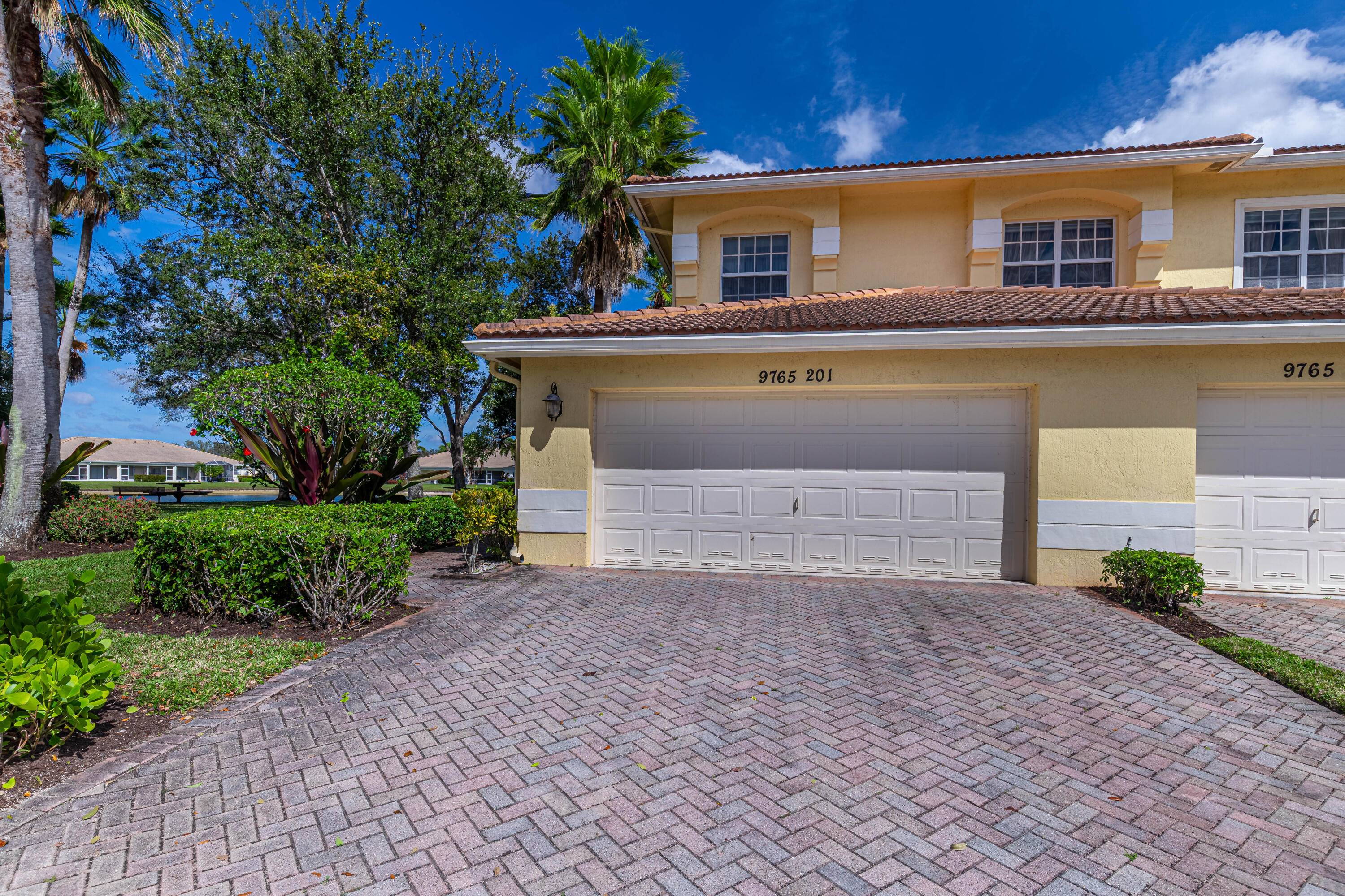 Absolutely stunning coach home on the water in a very sought after subdivision of Baywinds.