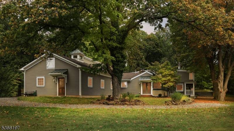 Welcome to this one of a kind restored and updated Farmhouse located on an unusually picturesque mountain top lot within desirable Watchung.