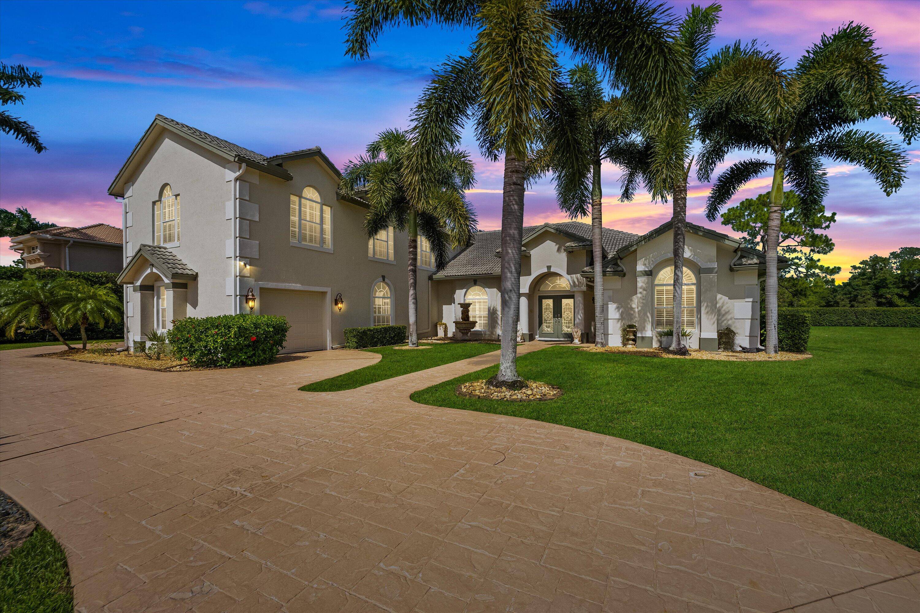 Exquisite Estate in Meadowood Country Club Community Discover unparalleled luxury in this expansive estate nestled within the prestigious Meadowood Country Club community in Fort Pierce.
